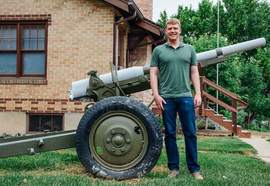 Joe Geiger stands in front of the ROTC building on the Mines campus